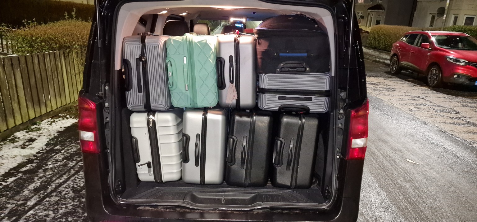 Luggage loaded in Raz Private Hire 8 seater for airport transfers